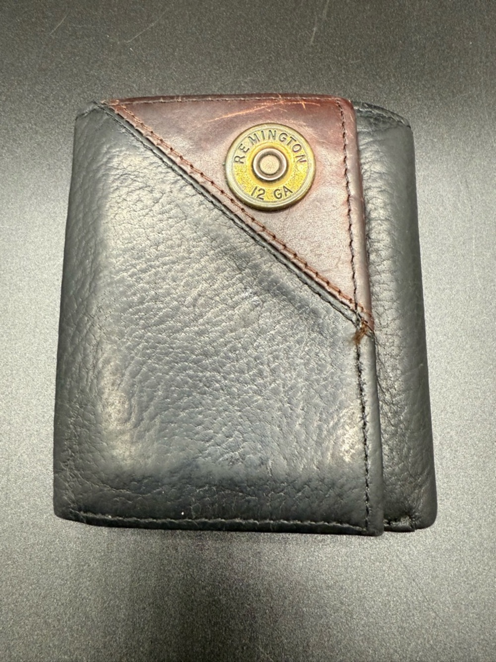 Remington Black Genuine Leather Bifold Wallet with Brown Accent and Shell Emblem